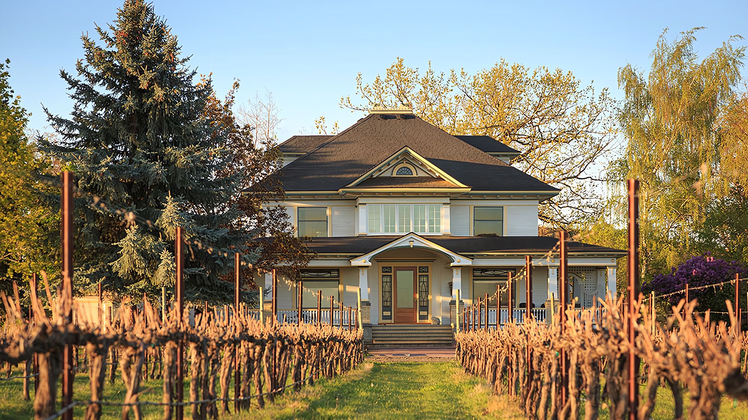 The restored farmhouse inn at Abeja framed by mature trees