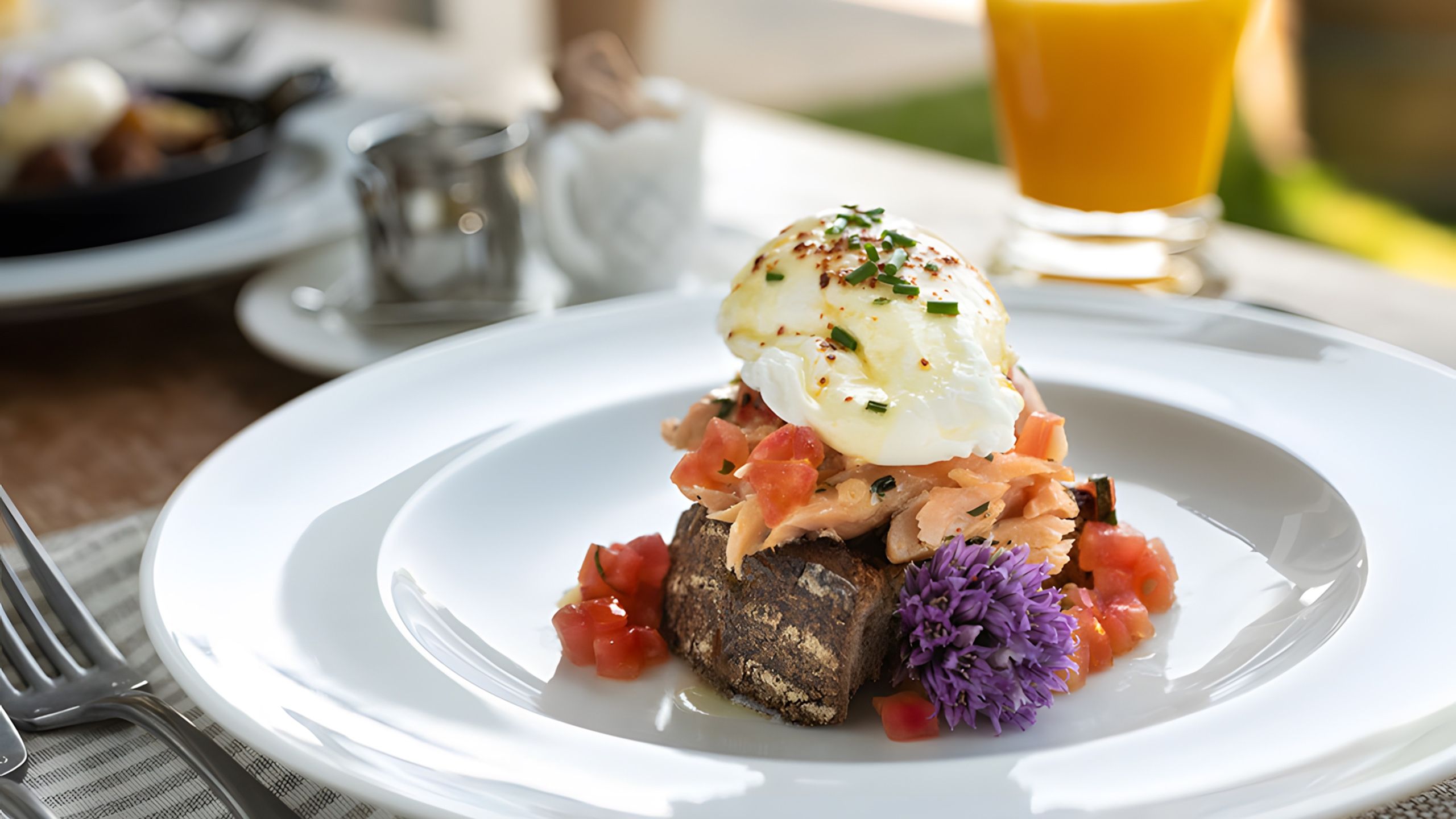 Abeja's signature eggs Benedict plated in the farmstead kitchen