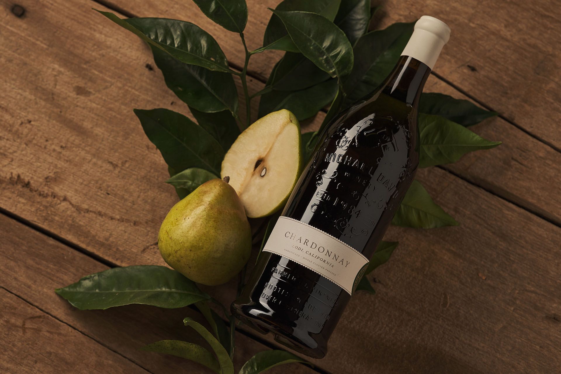 Golden-hued Chardonnay grapes on the vine at harvest time