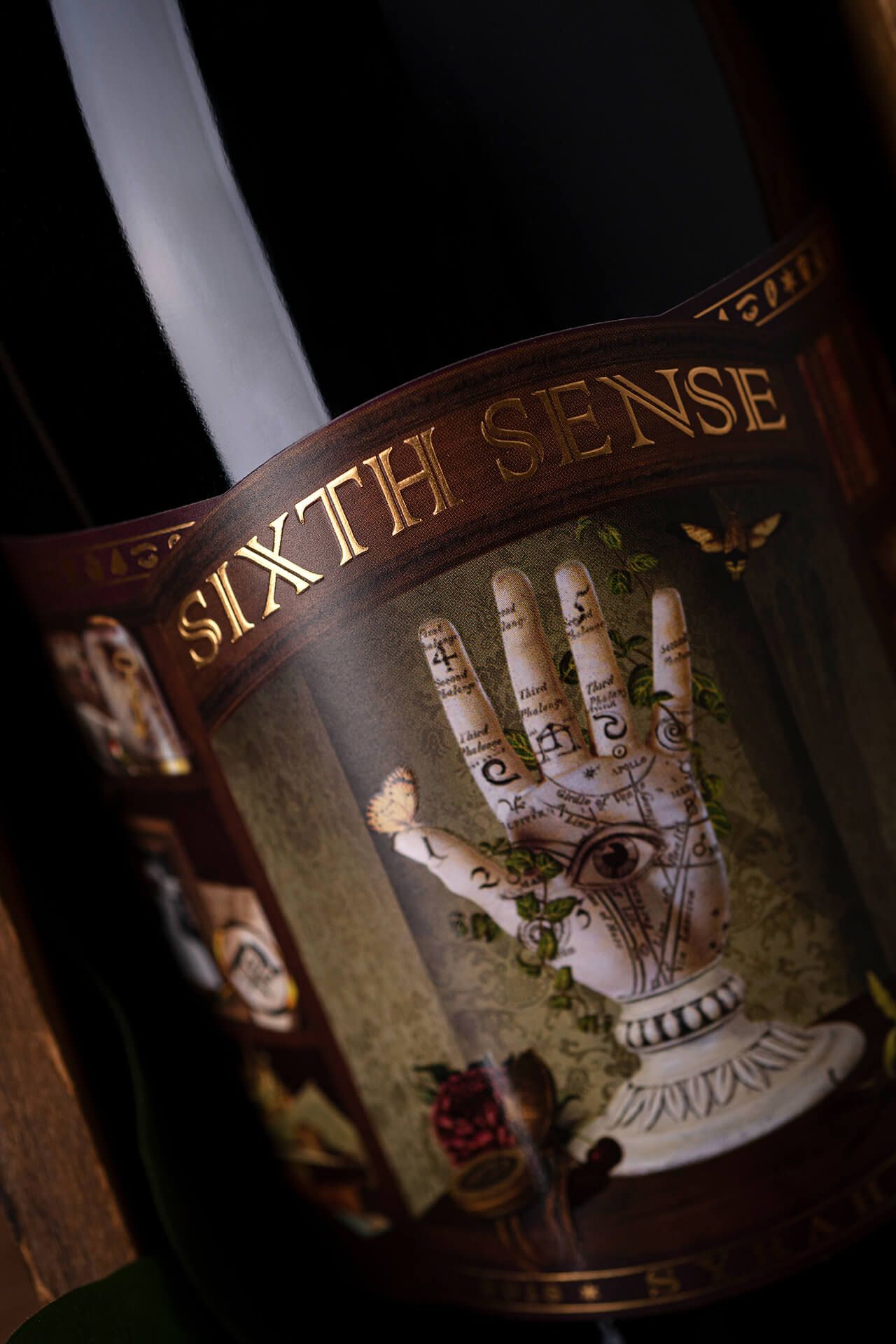 Label-detail and foiling texture shot of the updated Sixth Sense package, or a lifestyle pour